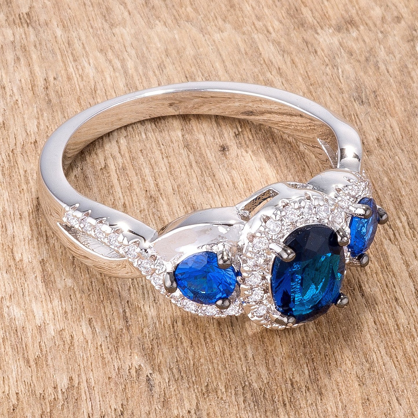 Rhodium Hematite Plated Sapphire Blue & Clear CZ Three Stone Twisted Ring