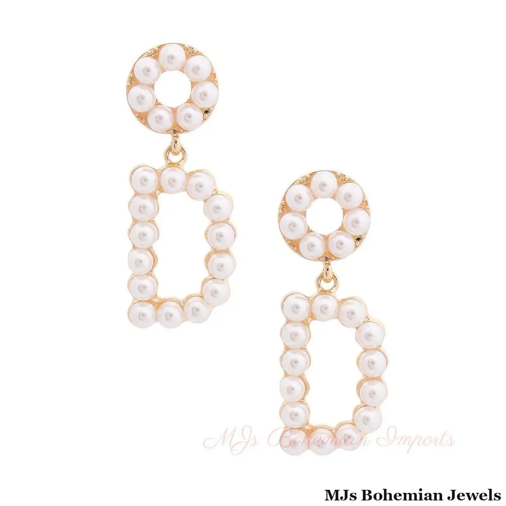 Cream Dangling D Earrings