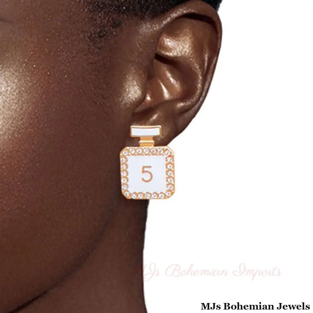 Glamorous Trio: Gold and White Chanel Earrings