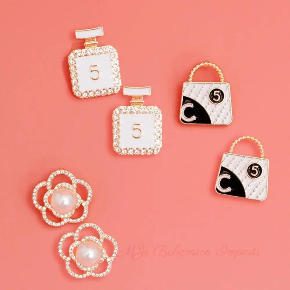 Glamorous Trio: Gold and White Chanel Earrings