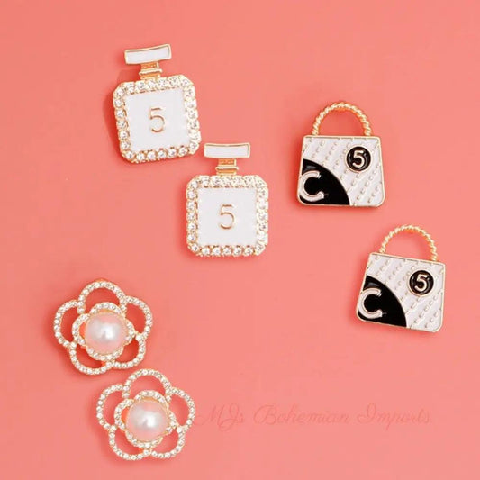 Glamorous Trio: Gold and White Chanel Earrings
