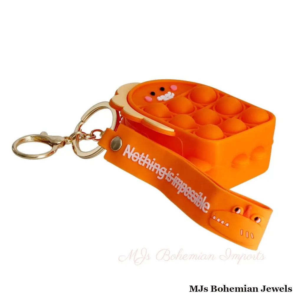 Orange Dino Bubble Pop Keychain