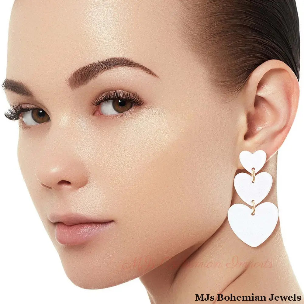 White Graduated Triple Earrings